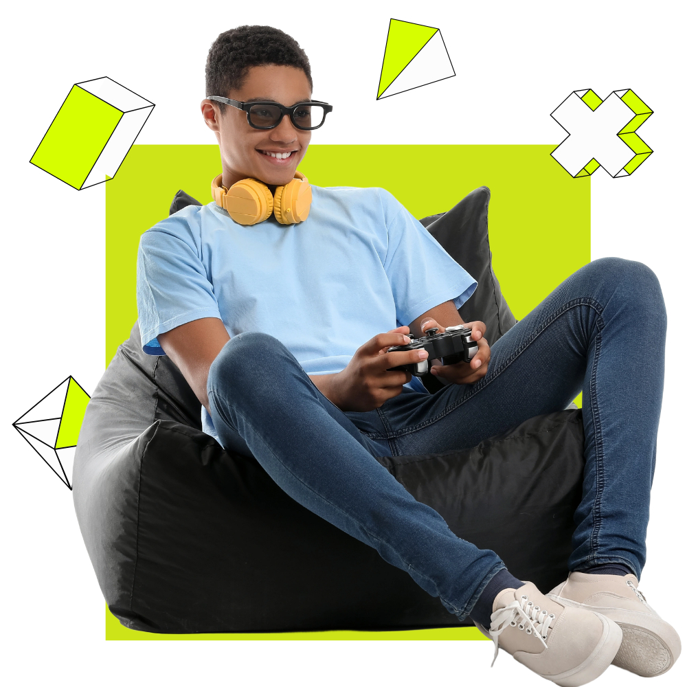 Gaming Content Moderation A smiling person wearing headphones and sunglasses sits on a black bean bag chair playing a video game, just like a dedicated game moderator ensuring gaming content moderation, with geometric shapes in the background.